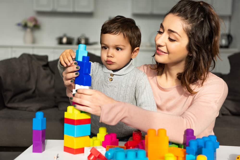 STEAM-STEAM toys for toddlers, mom playing with legos with son