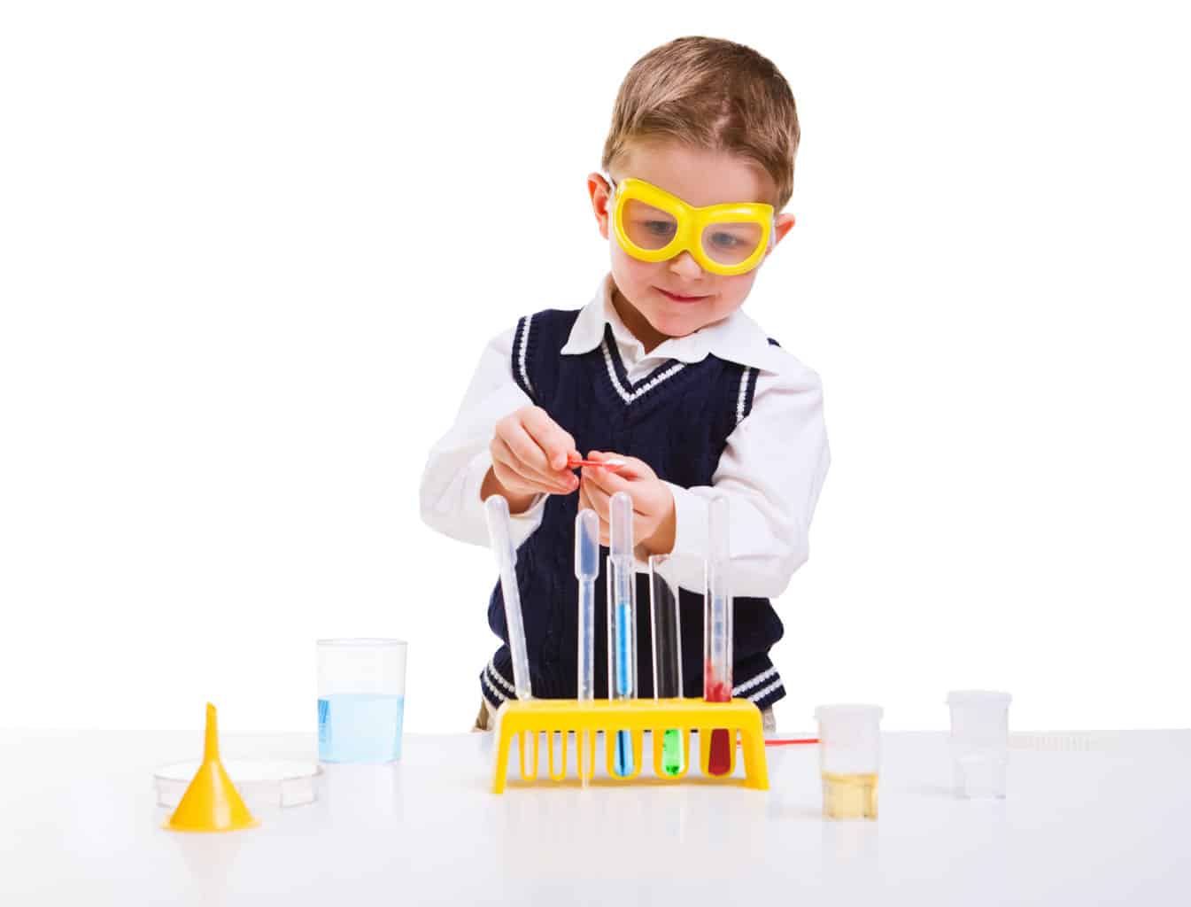 stem activities for 3-5 year olds, Young boy performing chemistry experiments with different liquids.