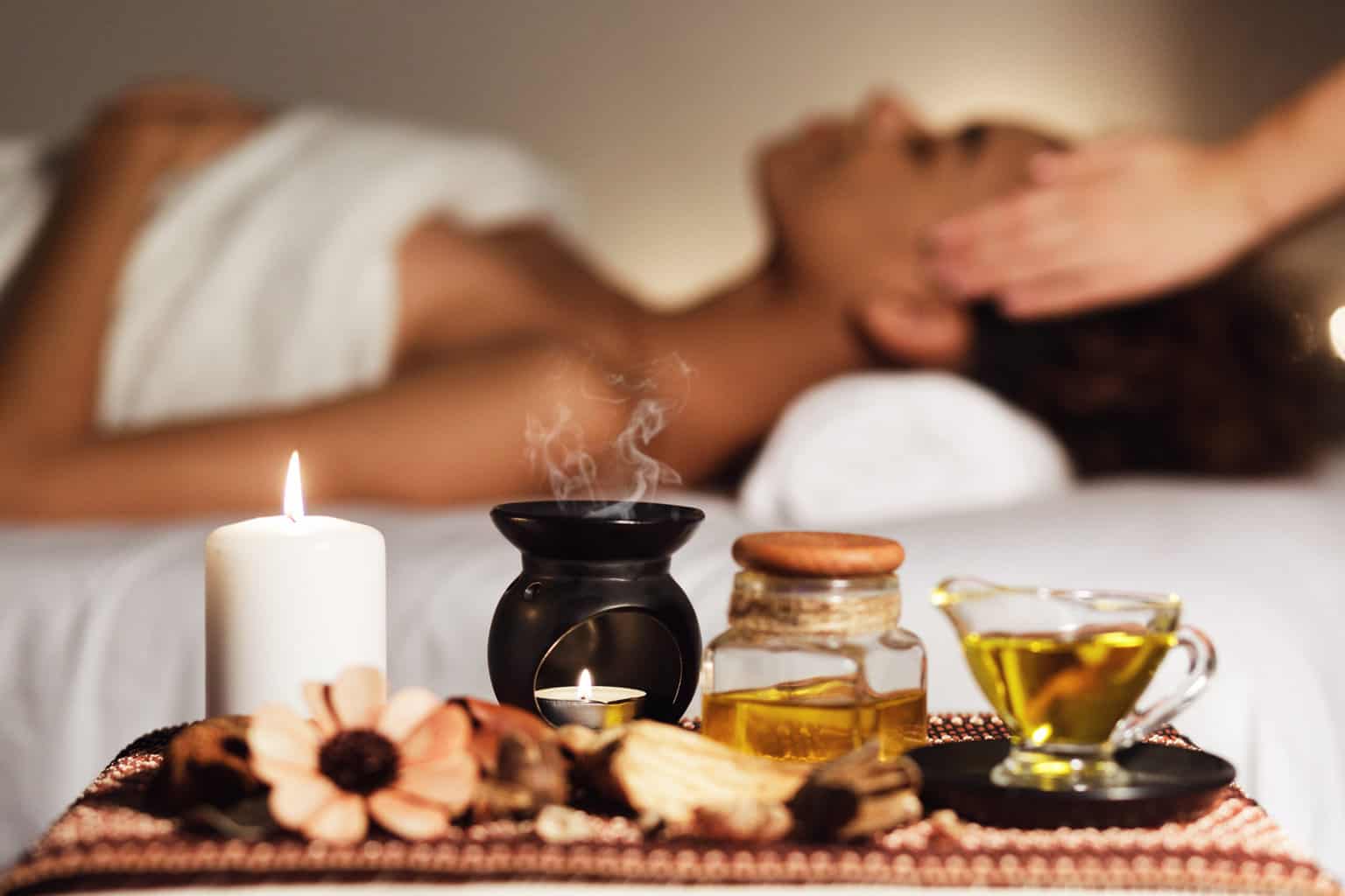 young woman getting spa tratment, best essential oil spa blend recipes for diffuser